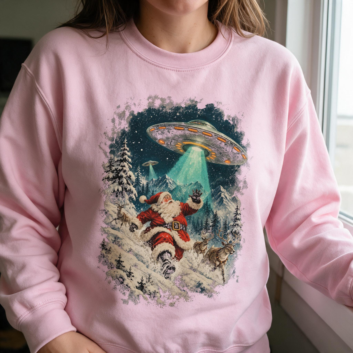 Model wearing the Santa Abduction sweatshirt in Light Pink