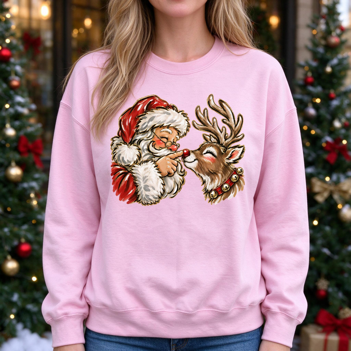 Model wearing the Santa Rudolph Nose Touch sweatshirt in Light Pink