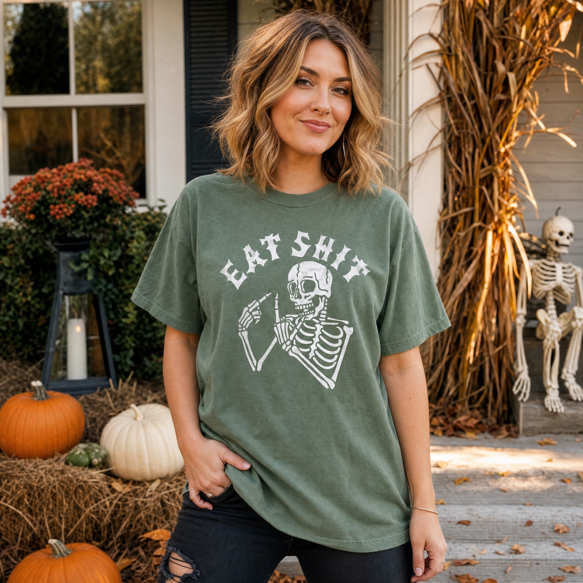 Model wearing the Skeleton Flipping Off comfort colors tee in Moss