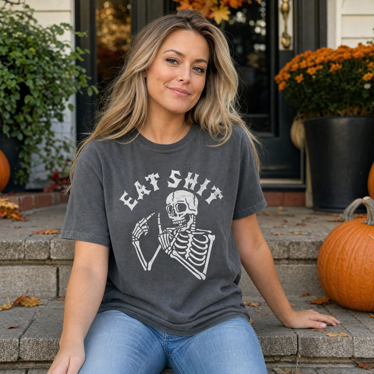 Model wearing the Skeleton Flipping Off comfort colors tee in Pepper