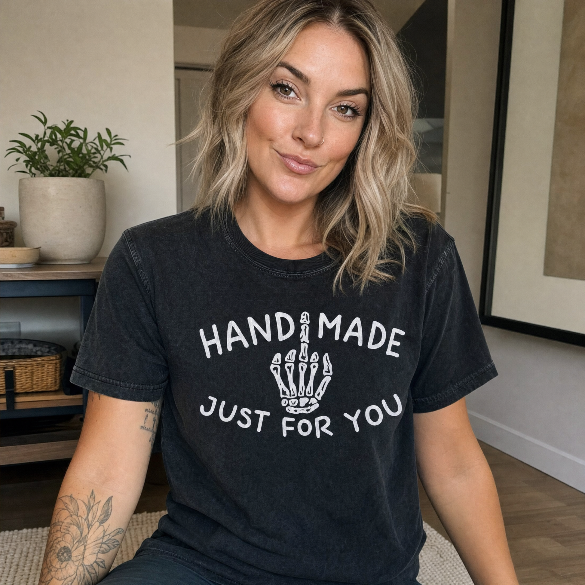 Model wearing the Skeleton Middle Finger comfort colors tee in Black, lifestyle image 1