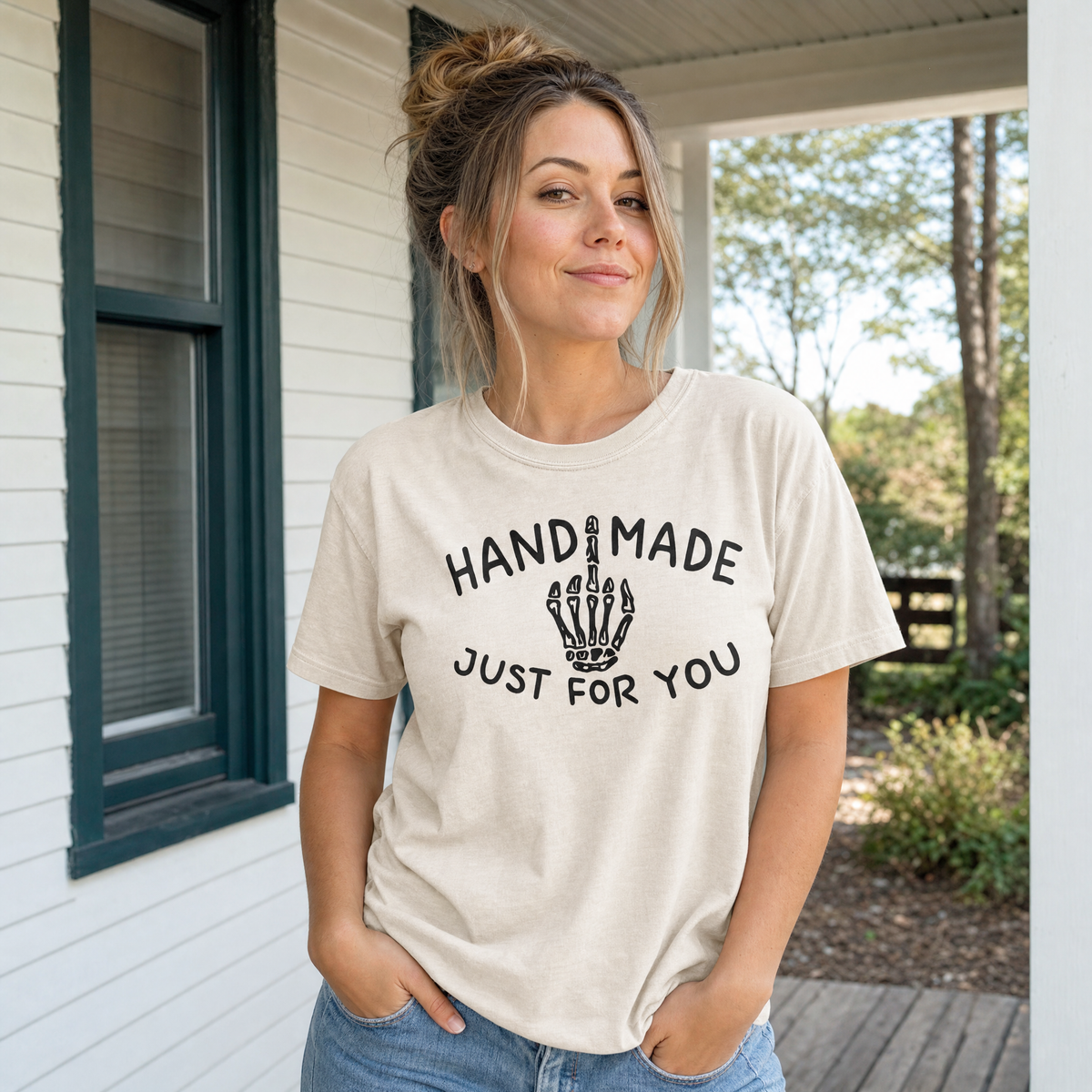 Model wearing the Skeleton Middle Finger comfort colors tee in Ivory