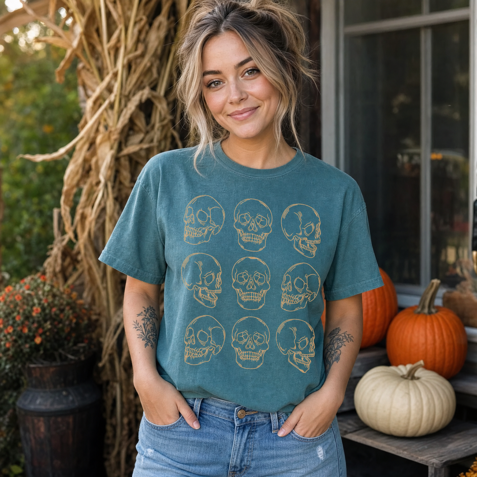 Model wearing the Skull Pattern comfort colors tee in Blue Spruce