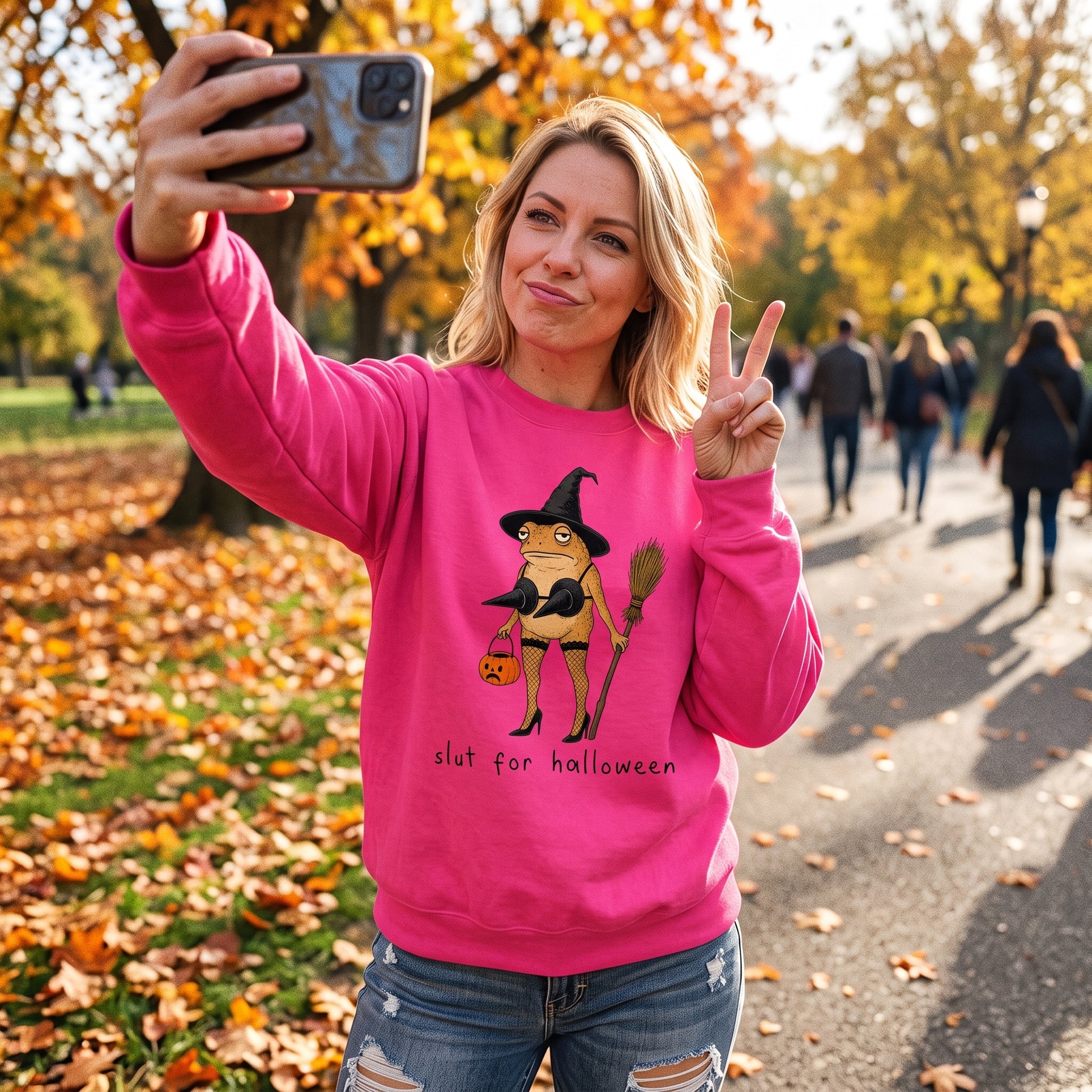 Model wearing the Slut For Halloween sweatshirt in Heliconia