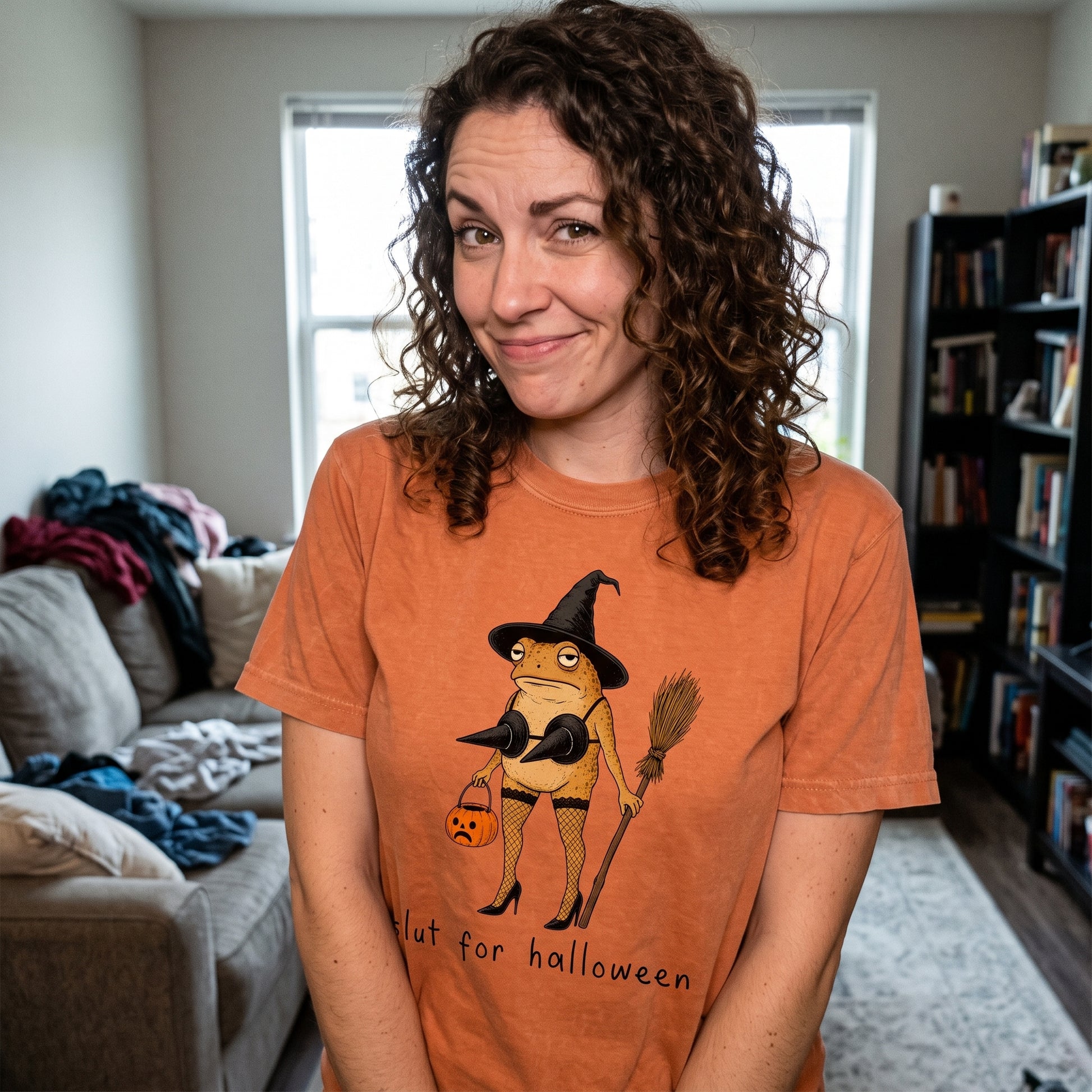 Model wearing the Slut For Halloween comfort colors tee in Yam