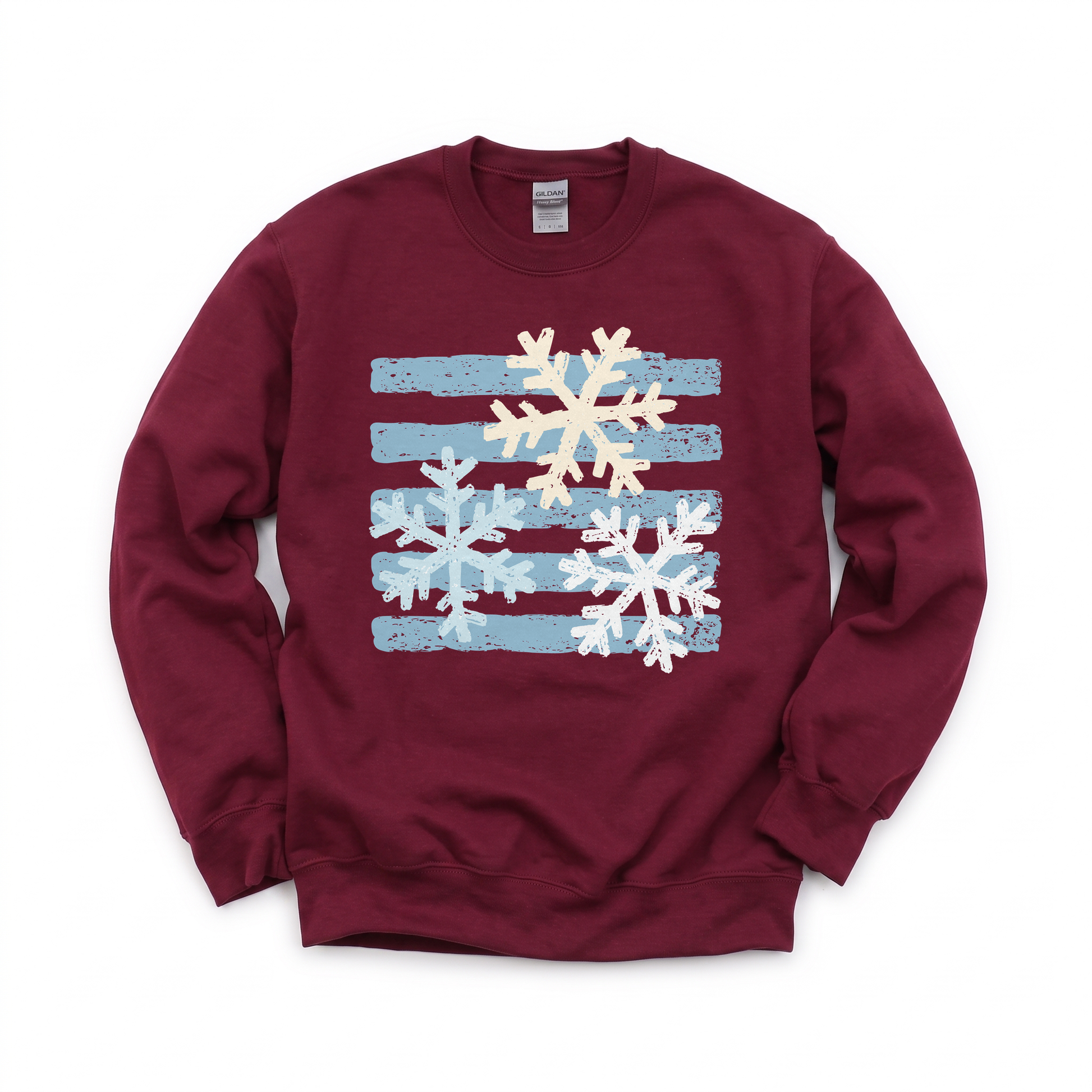 Snowflakes graphic on Gildan 18000B Youth Heavy Blend Sweatshirt in Maroon