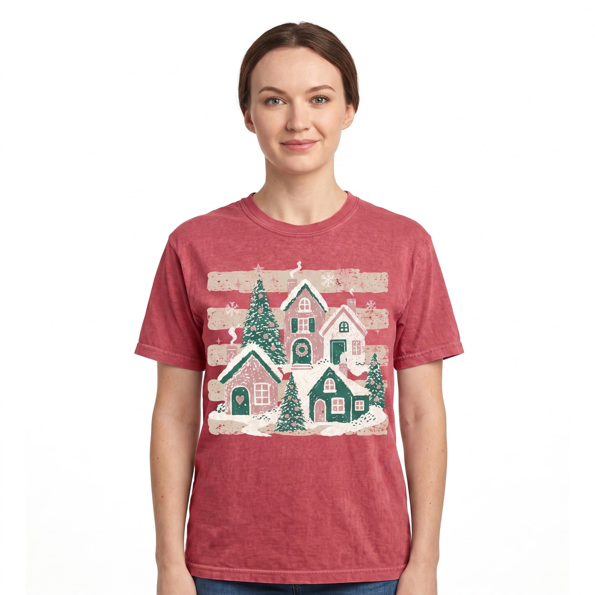 Model wearing the Snowy Christmas Village comfort colors tee in Crimson, cover image 1