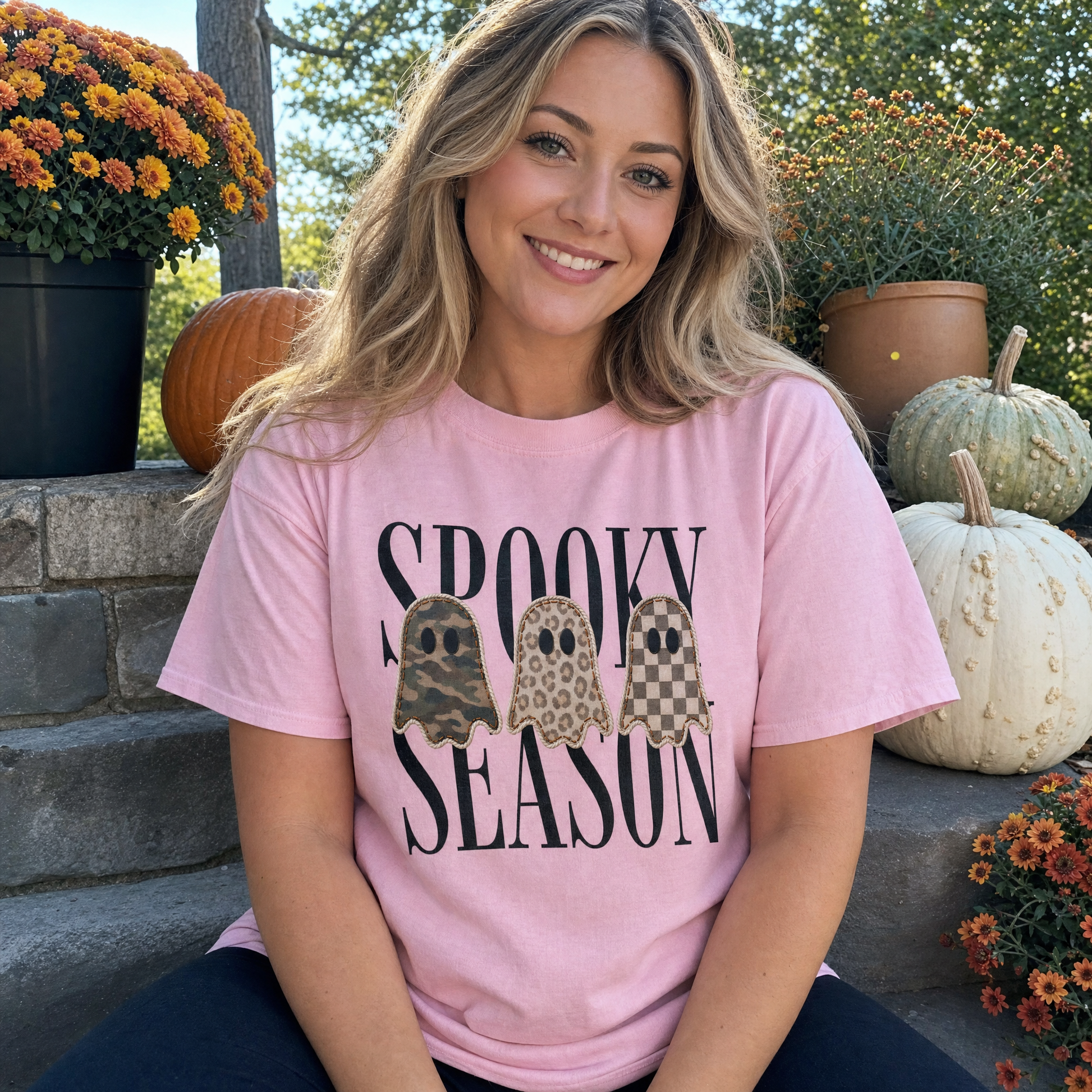 Model wearing the Spooky Season Ghosts comfort colors tee in Blossom, lifestyle image 1