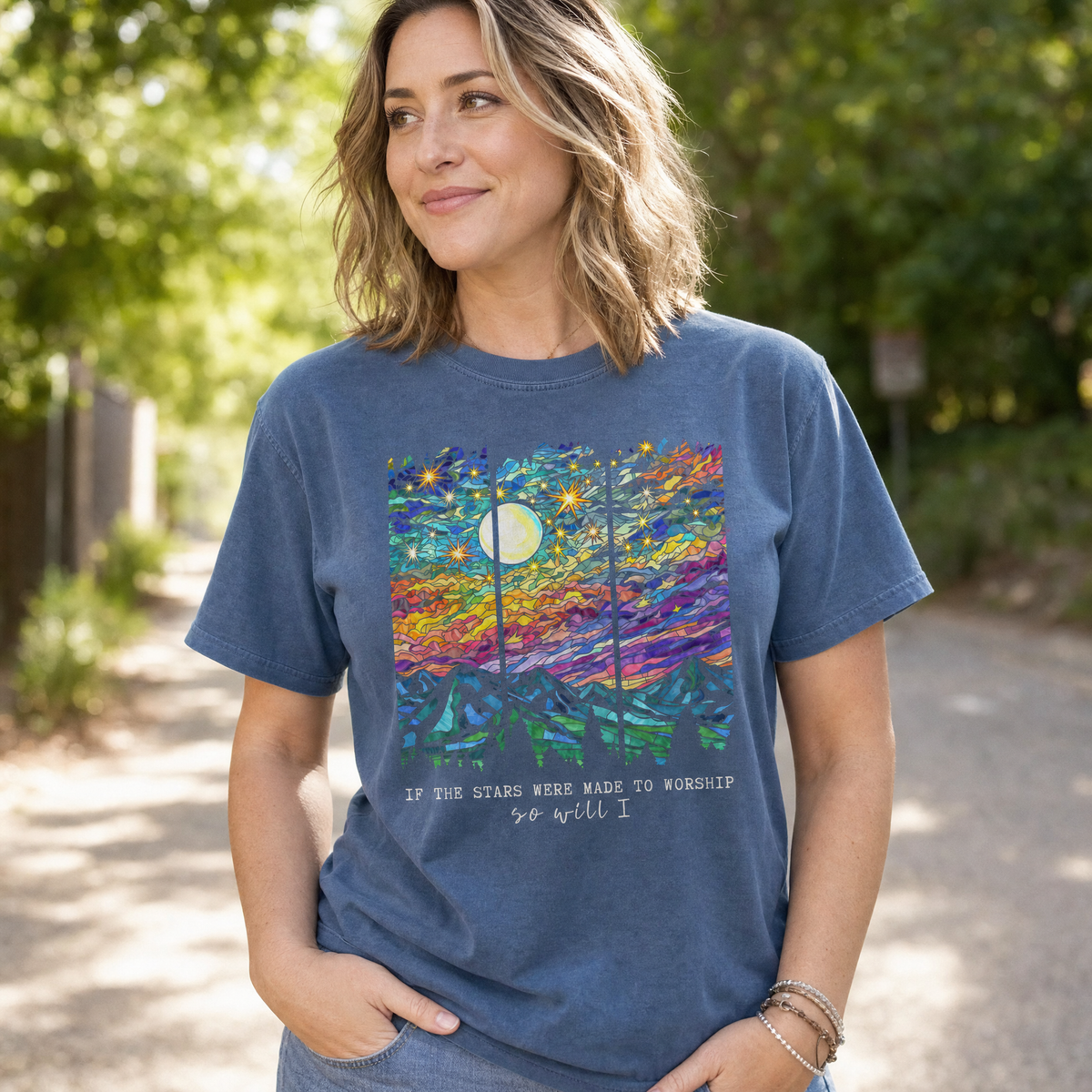 Model wearing the Stained Glass Mountain Night comfort colors tee in Denim