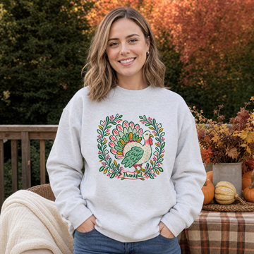 Model wearing the Thankful Turkey sweatshirt in Ash, lifestyle image 1