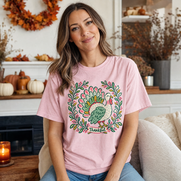 Model wearing the Thankful Turkey comfort colors tee in Blossom
