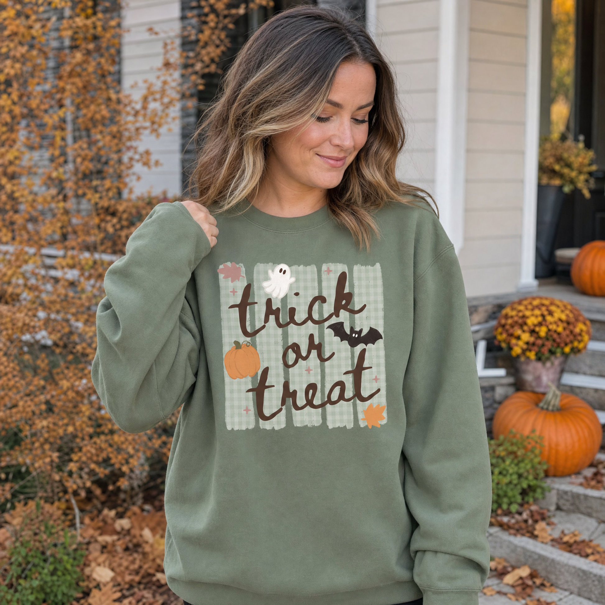 Model wearing the Trick or Treat sweatshirt in Military Green