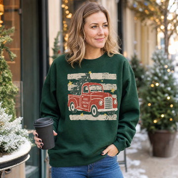 Model wearing the Vintage Christmas Truck sweatshirt in Forest Green
