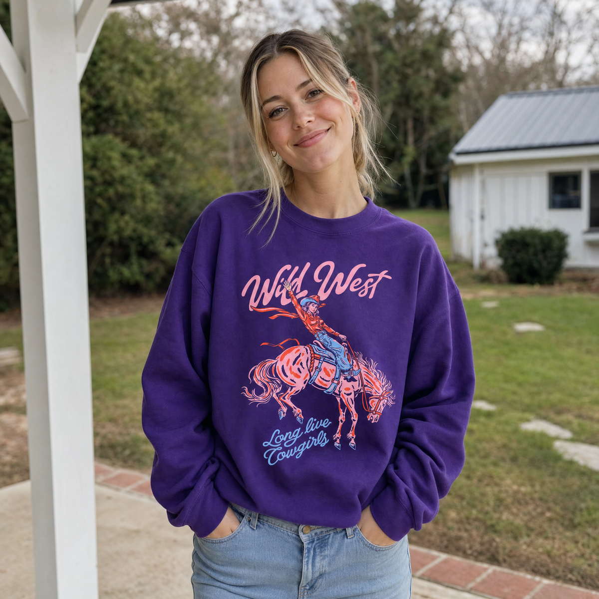 Model wearing the Wild West Cowgirl sweatshirt in Purple