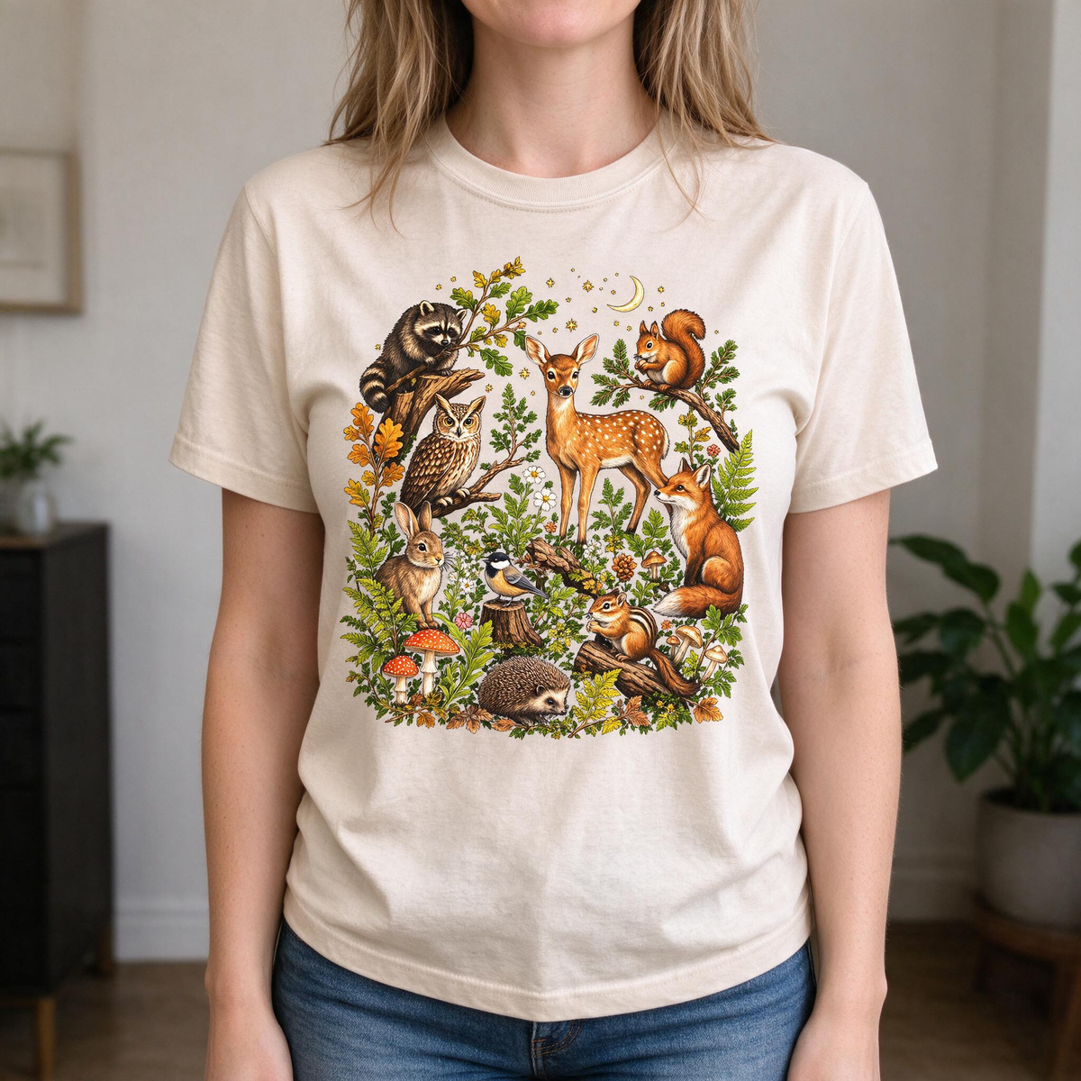 Model wearing the Woodland Animals comfort colors tee in Ivory, lifestyle image 1