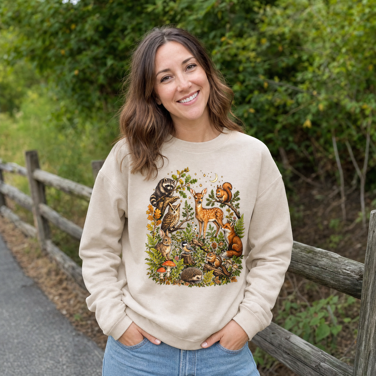 Model wearing the Woodland Animals sweatshirt in Sand
